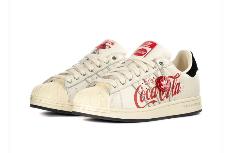 Adidas Superstar x Coca-Cola 'Enjoy Coca-Cola' Off-White Vintage Leather, Black Suede Heel, Red Script Print, Metal Charm & Black Outsole Limited Edition Collab Sneakers