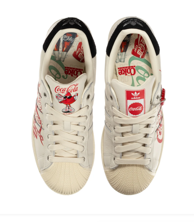Adidas Superstar x Coca-Cola 'Enjoy Coca-Cola' Off-White Vintage Leather, Black Suede Heel, Red Script Print, Metal Charm & Black Outsole Limited Edition Collab Sneakers