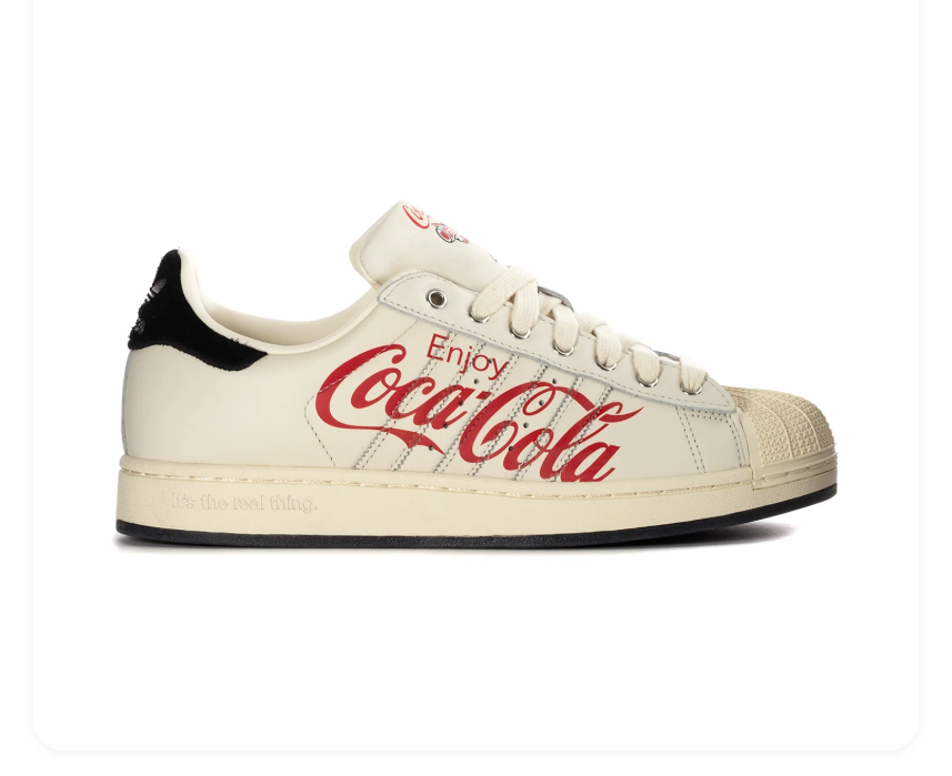 Adidas Superstar x Coca-Cola 'Enjoy Coca-Cola' Off-White Vintage Leather, Black Suede Heel, Red Script Print, Metal Charm & Black Outsole Limited Edition Collab Sneakers